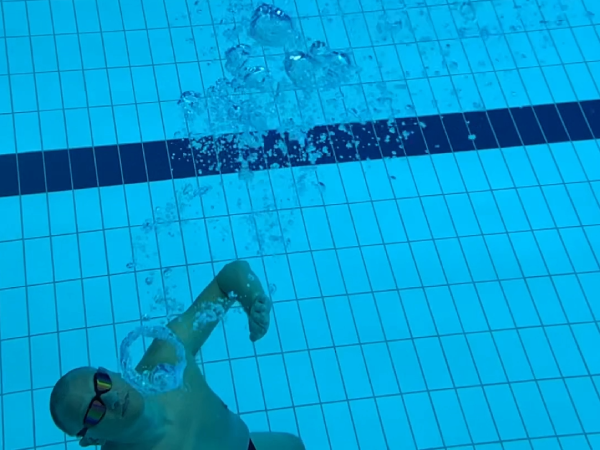 creating underwater air rings, similar to blowing smoke rings